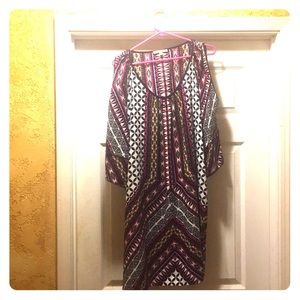 A multi colored dress with long sleeves